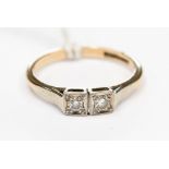 A 9ct & platinum set two stone diamond ring with square settings,