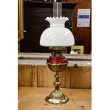 A mid Victorian brass oil lamp, by Hunks, Duplex with a glass funnel,