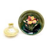 A Moorcroft squat lemon lustre vase impressed Moorcroft; together with a William Moorcroft plaque,