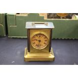 An American musical carriage clock, the dial with subsidiary dials, embossed face,