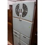 A 'Prestige' mid 20th Century painted kitchen cabinet, glass doors to top,