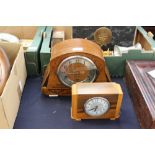 Two clocks, one in mahogany Art Deco design, 1930, inlaid scrolls in working order with key,