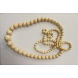 Late Victorian string of graduated ivory beads, approx 41'' in length.