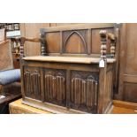 An early 20th Century oak Monks bench,