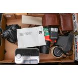 A box of vintage cameras plus accessories