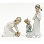 Two Lladro figures comprising girl holding a pair of slippers and a figure group of a girl and boy