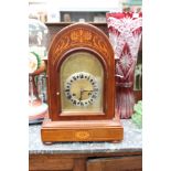 An Edwardian mahogany eight day mantle clock, the case inlaid with marquetry,