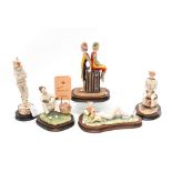 Five Border Fine Arts figures of clowns, four with boxes,