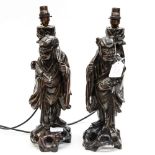 Two carved Chinese figures modified in to a pair of lamp bases Please note: the lamps in this lot