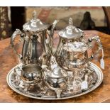 A collection of various silver plate, including coffee pot, teapot, milk jug, sugar bowl,