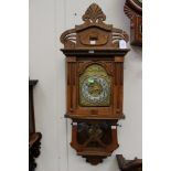 A Gustav Becker straight grained walnut Victorian wall clock with gilt metal decoration around