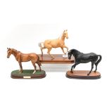 Beswick : a Palomino horse raised foreleg, matte glaze mounted on wooden plinth,