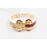 A diamond and ruby double scroll ring in 18ct yellow gold,