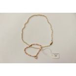 A single row cultured pearl necklace with a length approx length 18'' ;