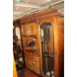 A Victorian walnut veneered wardrobe, fitted with two doors to each end,