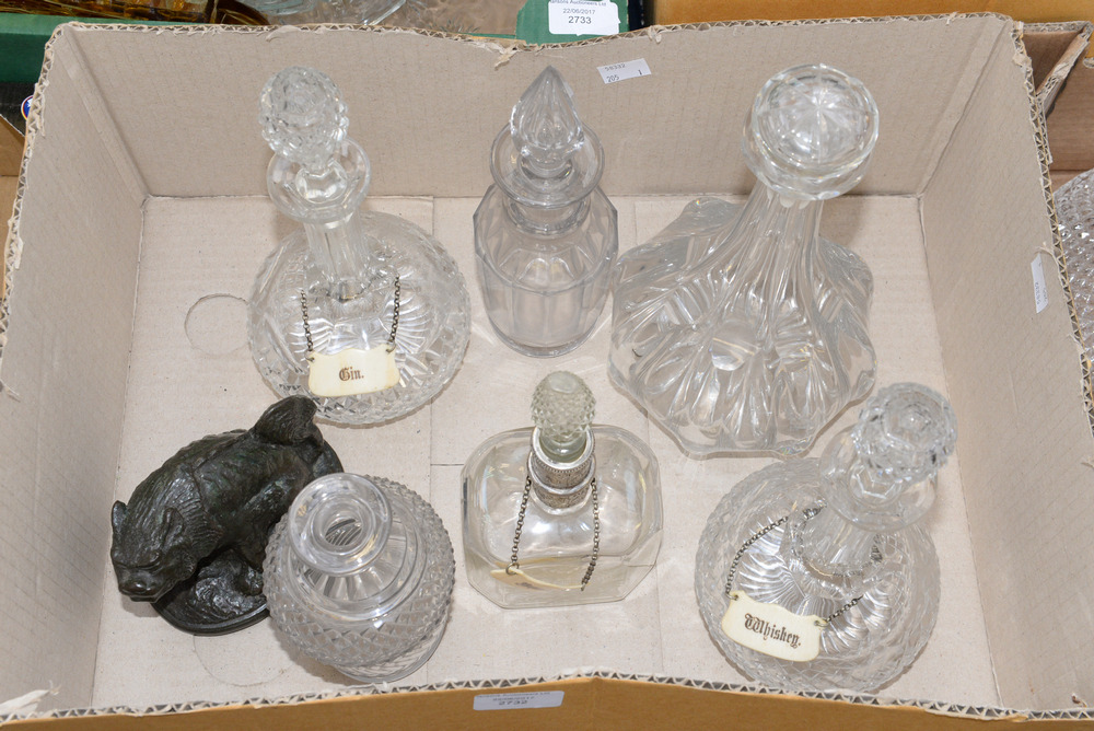 A box of assorted cut glass and wheel etched decanters,