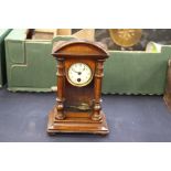 An early 20th Century walnut veneered 30 hour mantle clock,