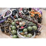 A selection of costume jewellery including plastic, glass and metal bead necklaces,