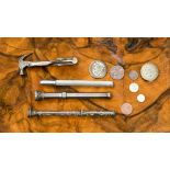 Two Victorian white metal propelling pencils and a novelty Stanley tie clip in the form of a hammer