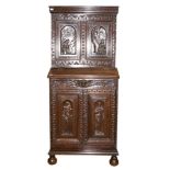 An 18th Century and later joined oak cabinet,