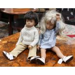 A pair of Sasha dolls (boy and girl)