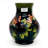 A large Moorcroft baluster vase Bird/Persimmon/Grape pattern green ground WM initials