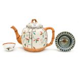 An Oriental style tea pot, having bamboo pattern handle, spout and finial,