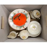 A collection of Susie Cooper Art Deco tea and dessert wares, comprising six cups and saucers,