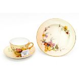 A Royal Worcester blush ivory trio, comprising cup saucer and side plate,