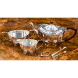 A George V silver three piece tea service to include teapot with Bakelite handle and finial,