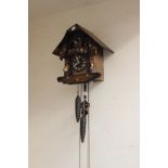 A Cuckoo clock with weights,