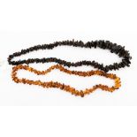 A graduated necklace of polished amber pieces, 24'' in length, weighing approx 54.