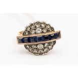 An Art Deco ring set sapphire and a mix of white stones and diamonds set in yellow metal stamped .