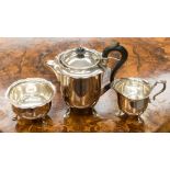 An early twentieth century three piece EPNS tea service, maker Joshua Maxfield and Sons,