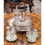 A six piece plated cruet set,