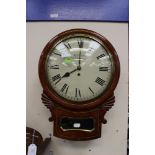 A Victorian mahogany round face wall clock with glazed pendulum case, Beeland of Newcastle,