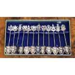 A set of fourteen silver teaspoons, all bearing names and crests of the states of Malaysia,