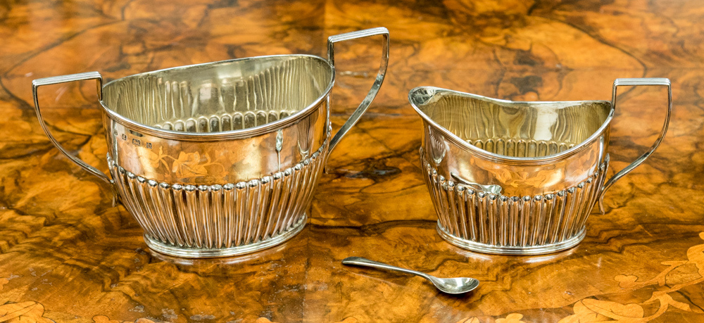 A silver half reeded sugar bowl and milk jug, Birmingham J Sherwood and Sons, 1901,