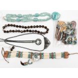 A collection of gemstone and glass bead necklaces,