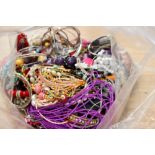 A selection of costume jewellery including plastic, glass and metal bead necklaces, earrings,