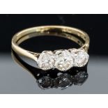 A diamond three stone 18ct yellow gold ring,