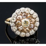 A white and brown three tier cluster ring,