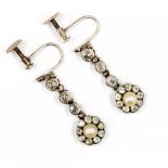 A pair of Edwardian diamond and pearl drop earrings comprising central pearl old European cut