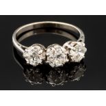 A diamond three stone platinum ring,