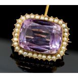 A Victorian amethyst and seed pearl cushion shaped yellow gold brooch,