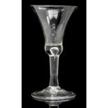 An 18th century wine glass, the basally knopped trumpet bowl with teardrop inclusion,