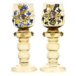 A pair of 19th century German hock rummers, Bohemian enamelled coats of arms for a marriage,