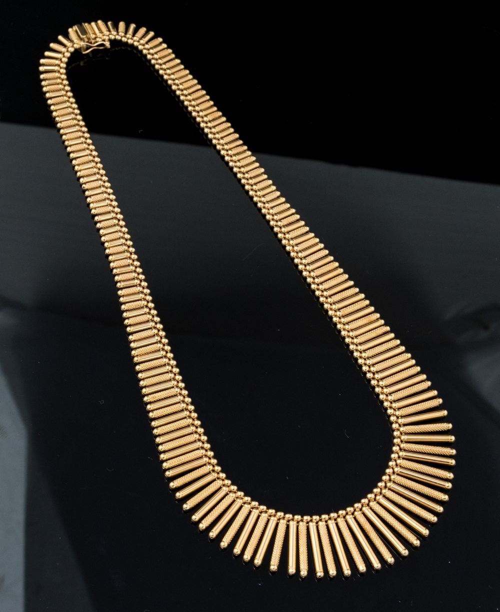 An 18ct two colour gold Italian fringe necklace, the graduating tubular,