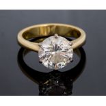 A diamond solitaire 18ct yellow gold ring, the round brilliant cut diamond weighing approximately 3.