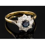 A sapphire and diamond 18ct yellow gold round cluster ring,